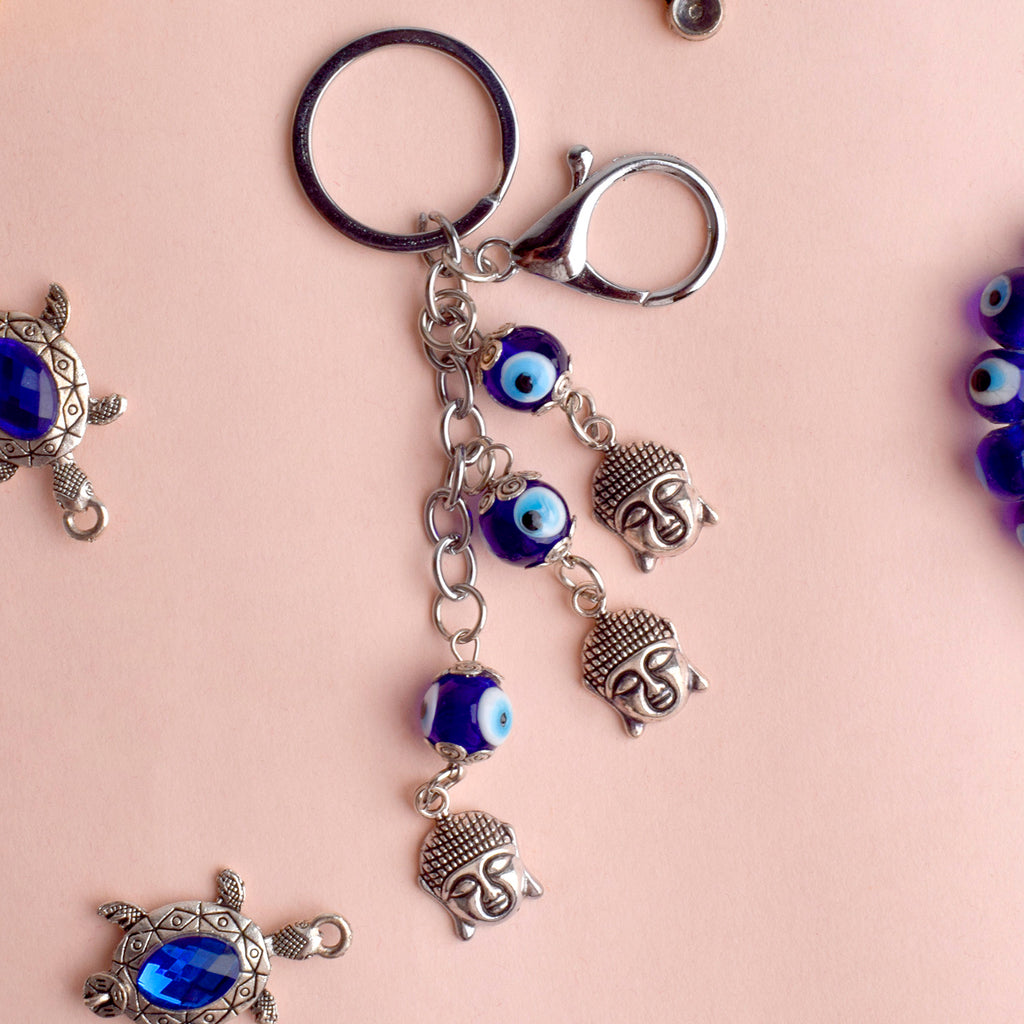 3 Tier Buddha Keychain with Evil Eye – A spiritual and protective charm for keys, bags, or gifts. India’s Largest Pooja Accessories Brand – www.satvikstore.in