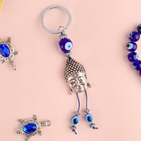 Alluring Silver Buddha Keychain with Evil Eye, a blend of spiritual protection and elegance, bringing peace and positivity into your life. India’s Largest Pooja Accessories Brand – www.satvikstore.in