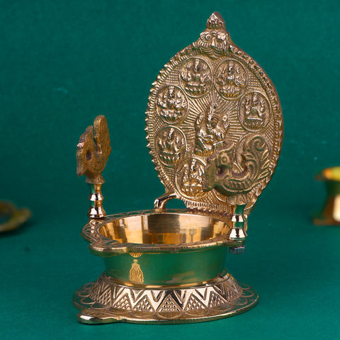 Beautifully engraved Brass Ashtalaxmi Diya featuring intricate depictions of the eight forms of Goddess Lakshmi, designed for auspicious rituals, festive decor, and spiritual ambience in homes and temples. India’s Largest Pooja Accessories Brand – www.satvikstore.in