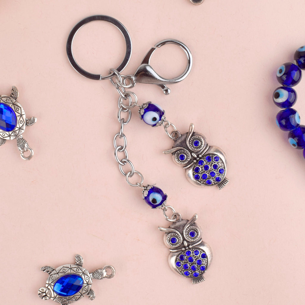 Double Owl Evil Eye Keychain – A protective and spiritual charm with twin owls for wisdom and positivity. India’s Largest Pooja Accessories Brand – www.satvikstore.in