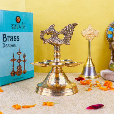 Brass 1 Step Panchmukhi Peacock Kerala Diya – Handcrafted brass diya with a Panchmukhi (five-faced) design and peacock motif, perfect for pooja ceremonies, temple lighting, and traditional décor. India’s Largest Pooja Accessories Brand – www.satvikstore.in
